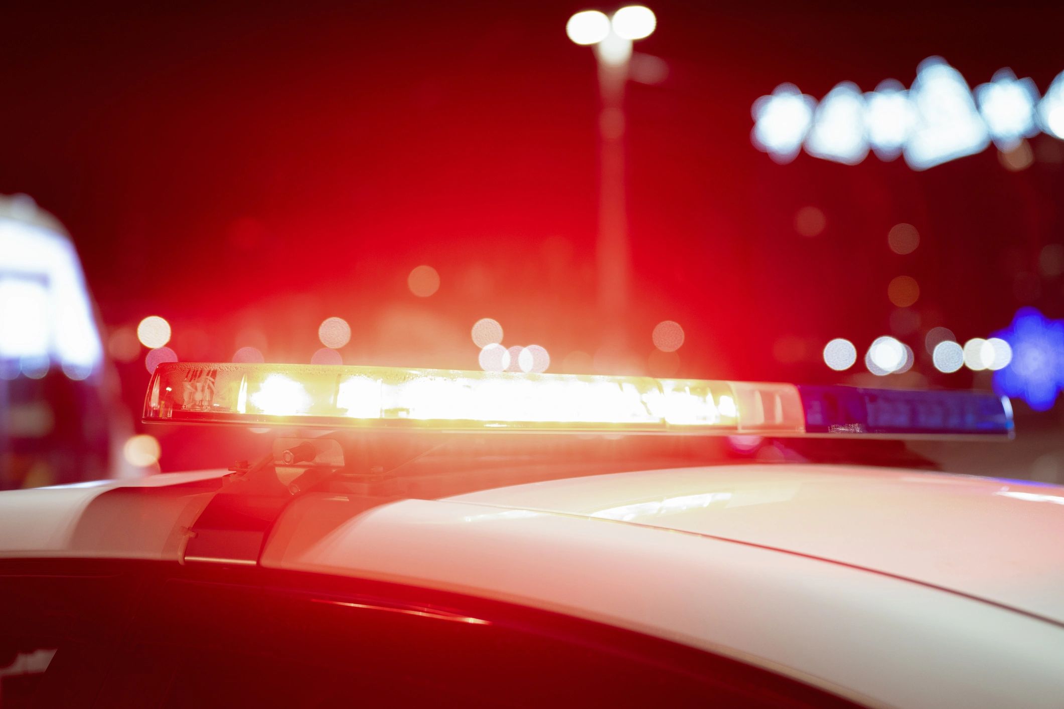 Close-up of flashing police vehicle lights at night