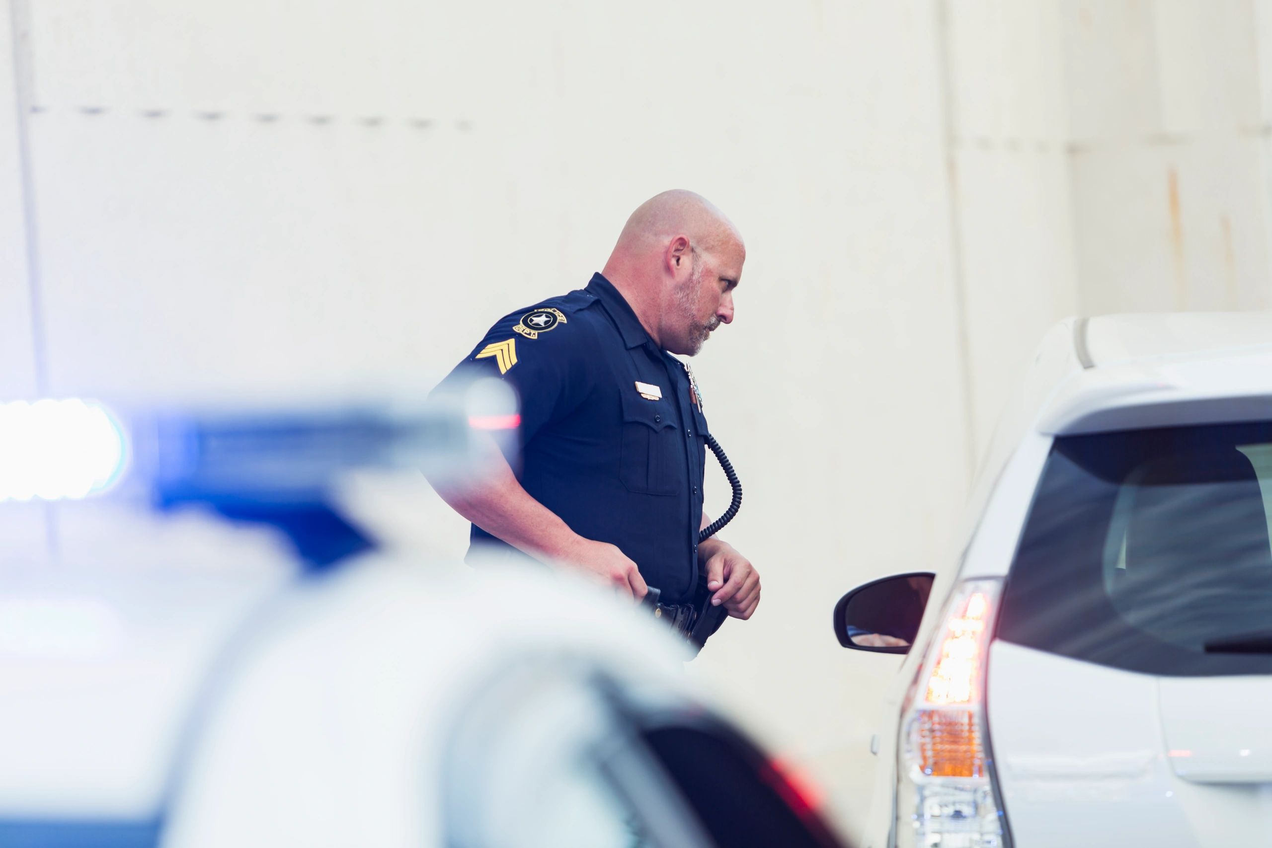Law enforcement officer speaking with a driver